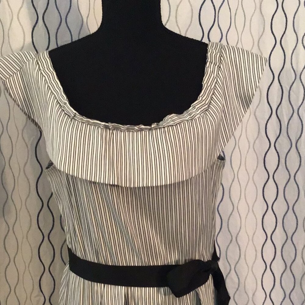 Cute, off the shoulder ruffle bottom dress with sash belt